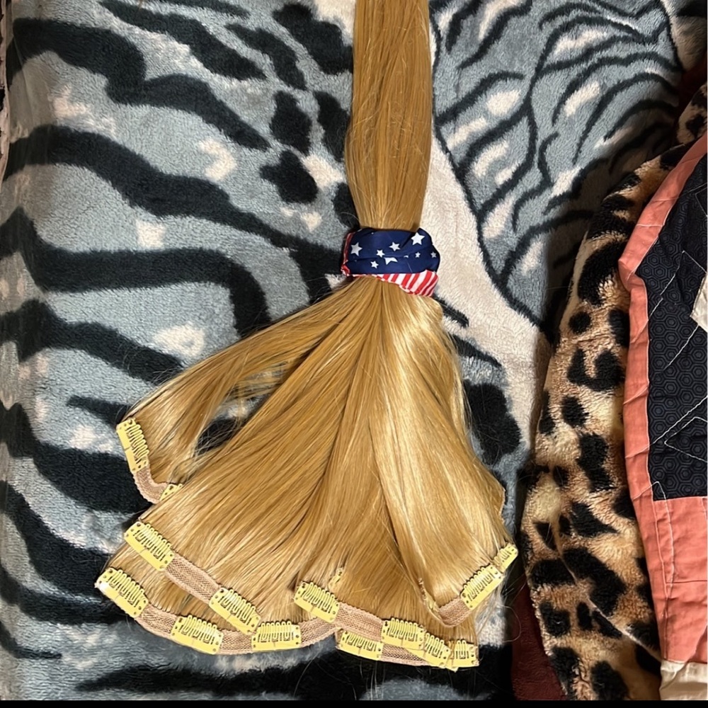 Two packs of clip in blonde synthetic hair extensions. NEW WITHOUT TAGS!!!!
